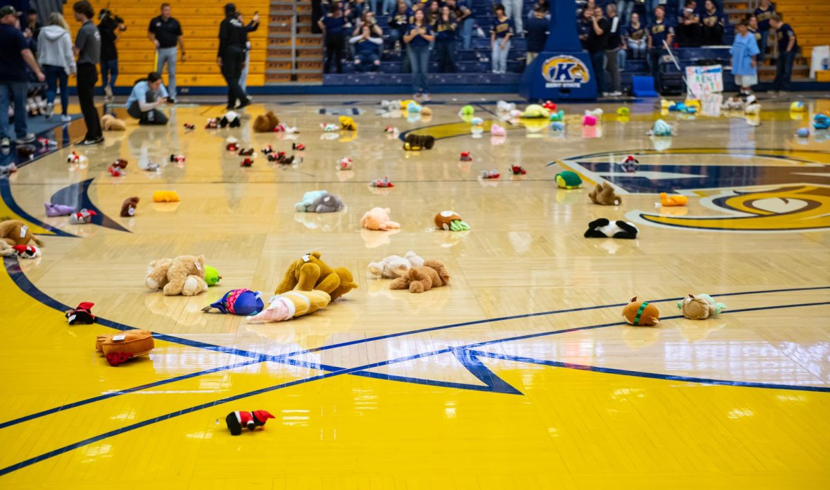 Stuffed animals dot the floor of the basketball court following a teddy bear toss held at halftime during the game against Xavier, Friday, Nov. 23, 2024. The stuffed animals will be donated to Caring for Kids Foster Agency.