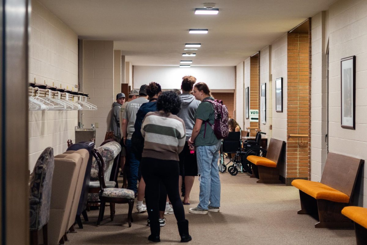 People wait in line at the United Methodist Church of Kent to vote on Nov. 5, 2024.