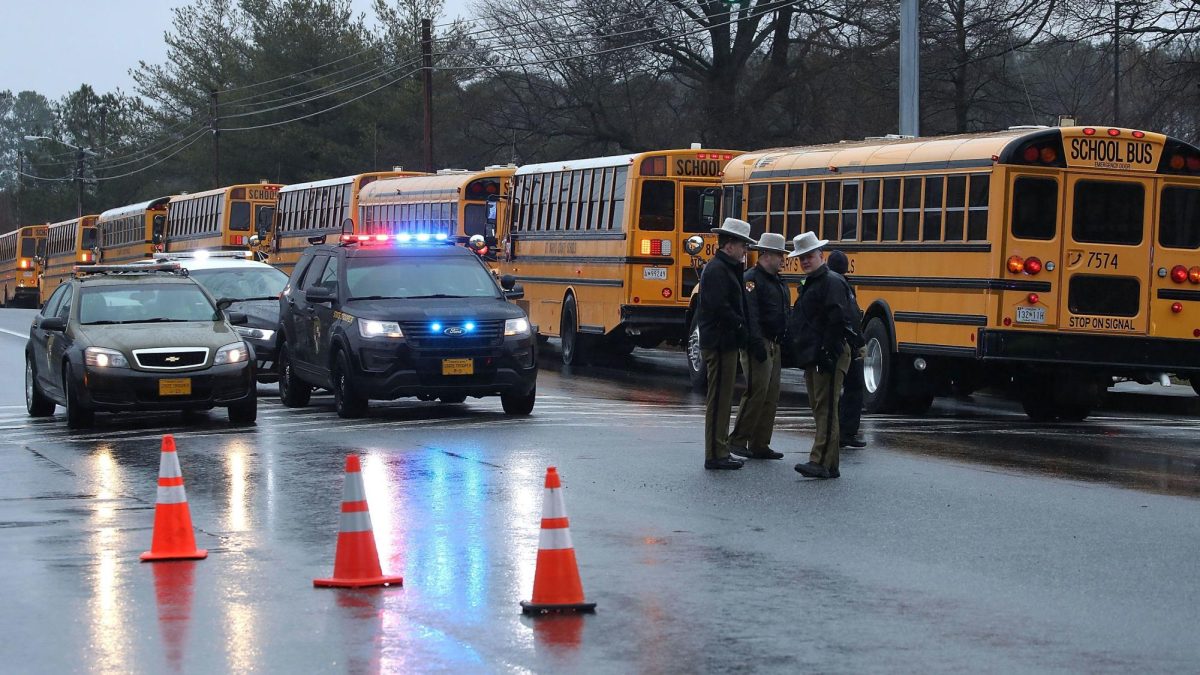 School buses are lined up in front of Great Mills High School after a shooting on March 20, 2018, in Great Mills, Maryland.  It was reported that two students at a Maryland high school were injured after a colleague opened fire in the hallway just before classes began.
